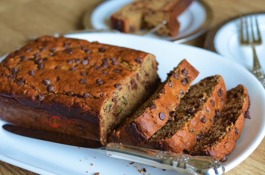 Sliced baked banana bread over on a board.