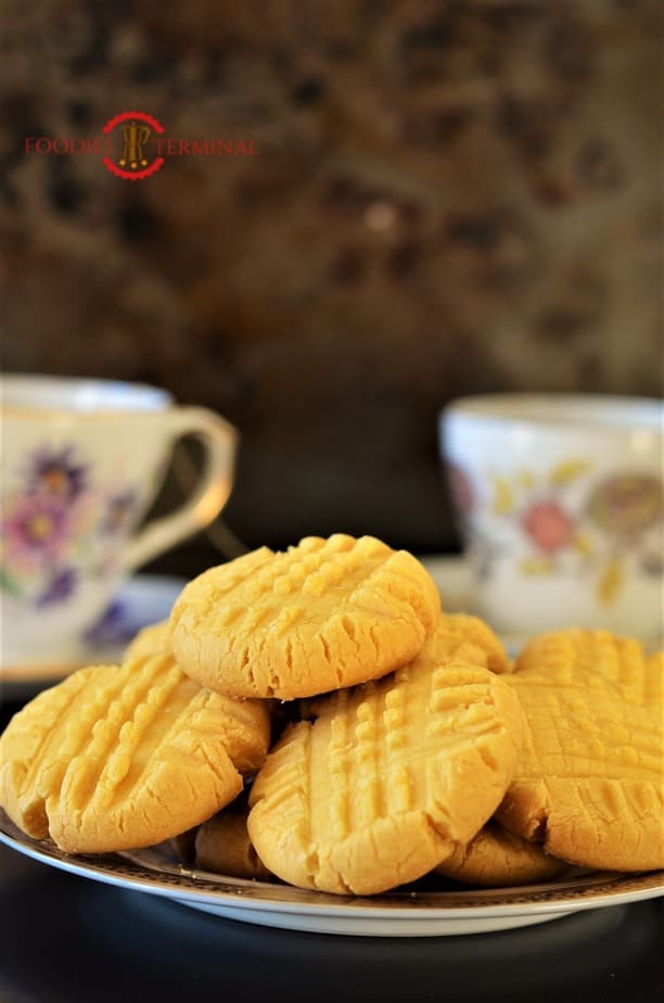 Custard cookies server on a plate with tea.