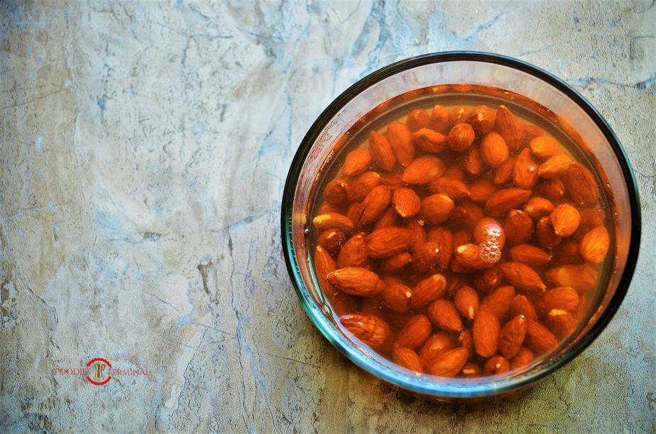 Soaking the almond in a dish.