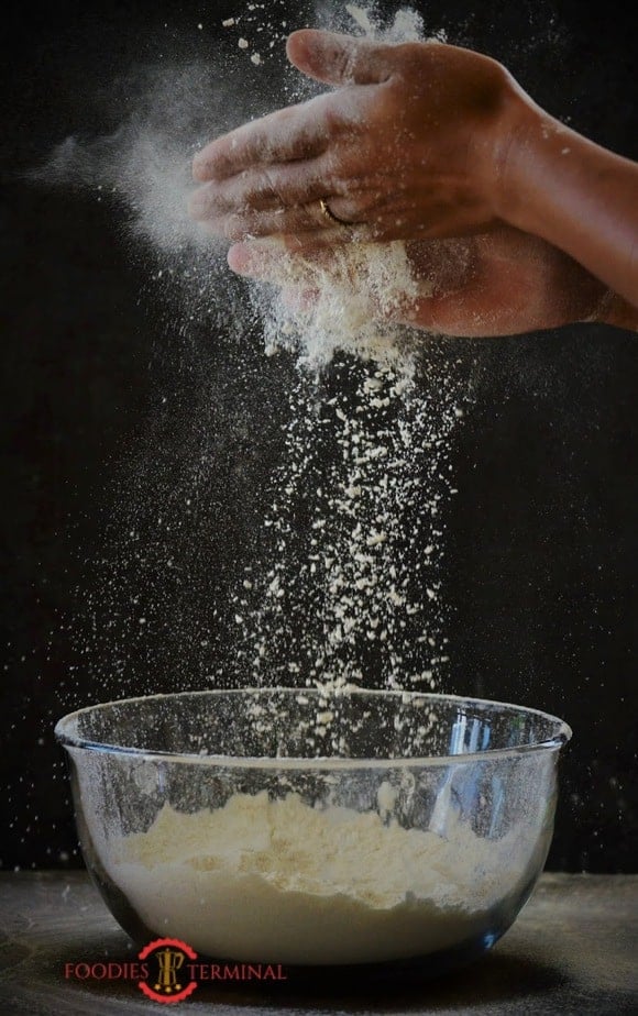 Flour in a glass bowl.