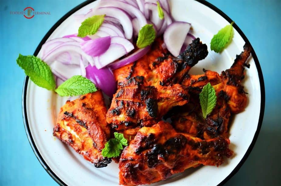 Tandoori chicken served on a dish.