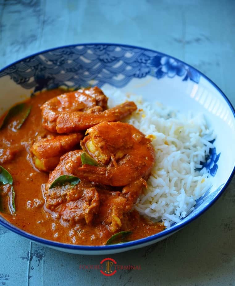 Goan Prawn Curry served with rice on a plate.