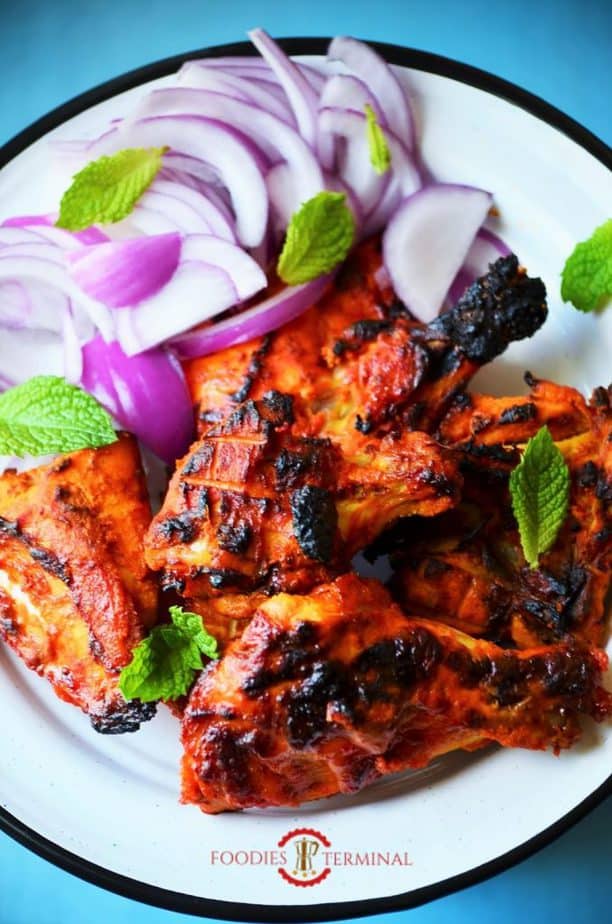 Tandoori chicken served on a dish.