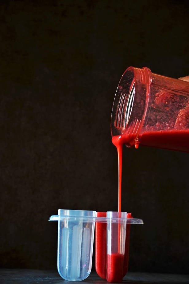 Strawberry juice poured in the ice-cream mould