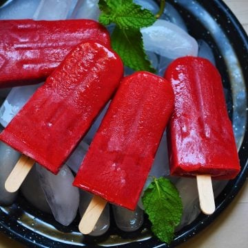 strawberry popsicle served in a plate on ice