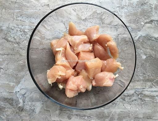 Chopped chicken pieces in a bowl

