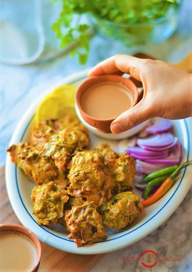 Chicken pakora in air fryer served with chai in terracotta cups