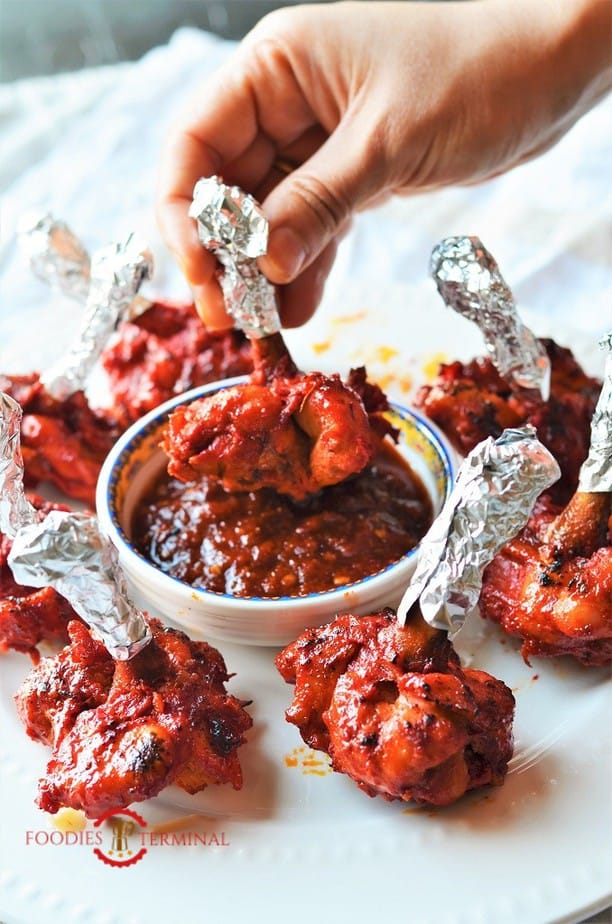 How To Make Chicken Lollipop From Wings Video Chicken Lollipop Recipe Baked Foodies Terminal