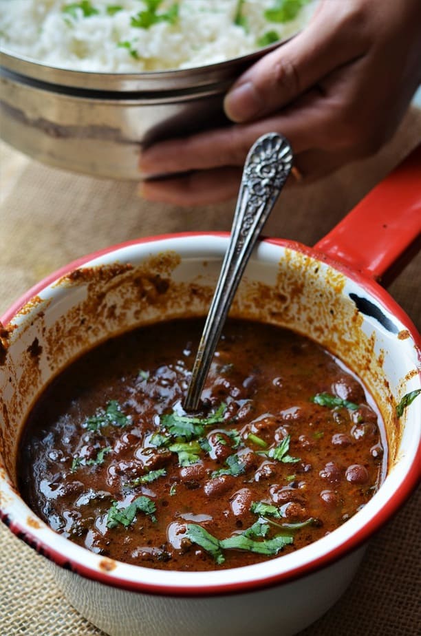 Instant Pot Rajma curry recipe cooked in a spicy sauce & garnished with chopped cilantro