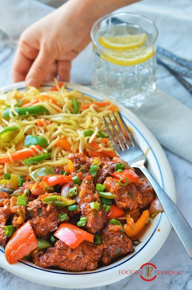 Indian style chilli chicken dry in a white plate