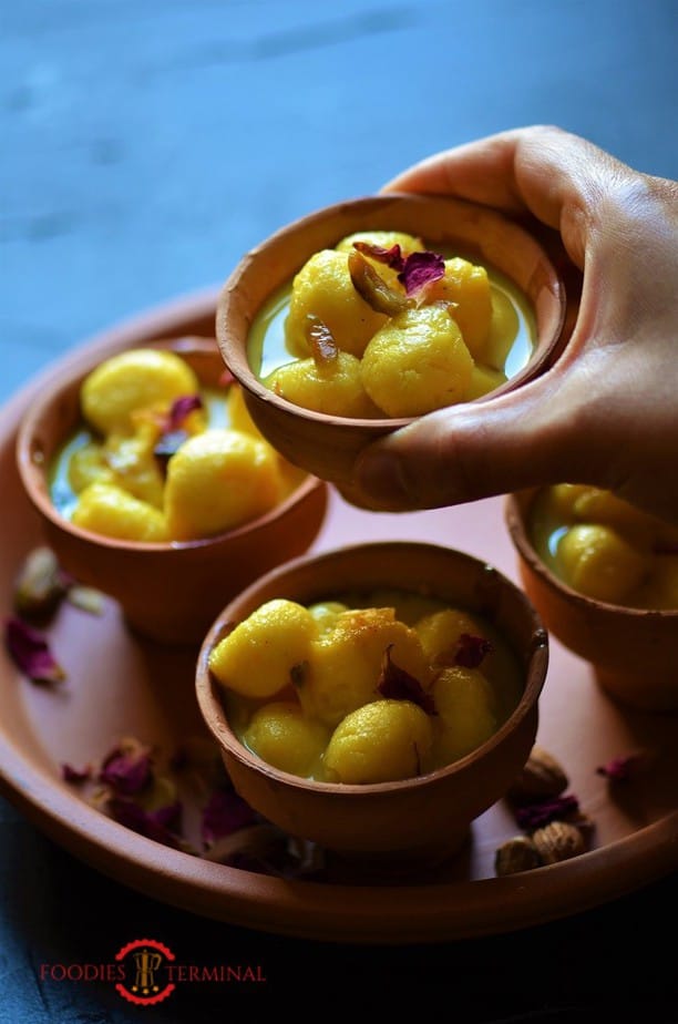 Angoori rasmalai garnished with rose petals