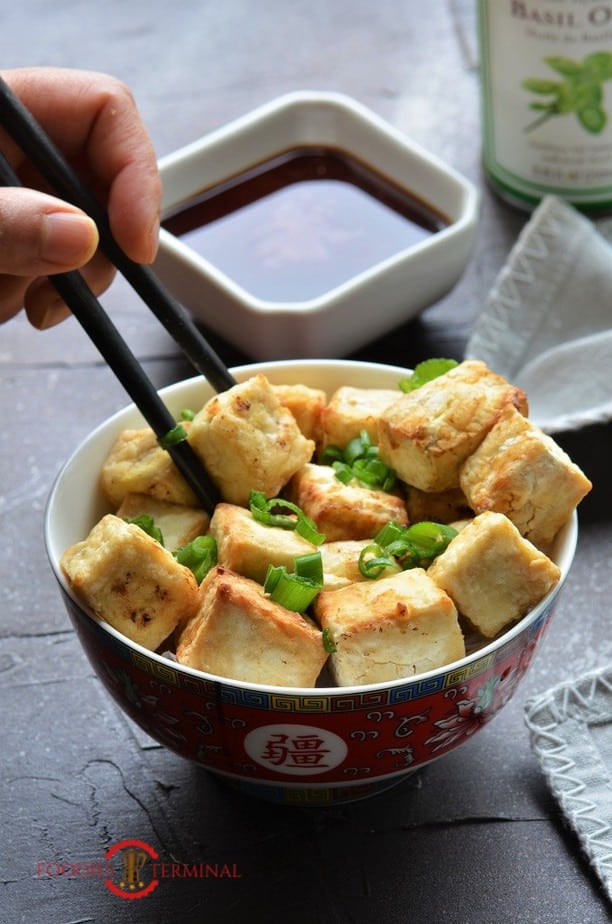 Air Fried Tofu Bites eaten with chopsticks