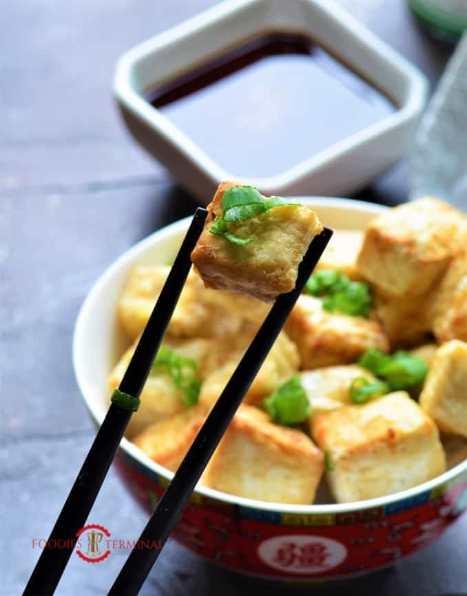 Air Fried Tofu picked with chopsticks