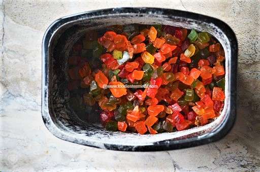 Candied papaya pieces in a black tray