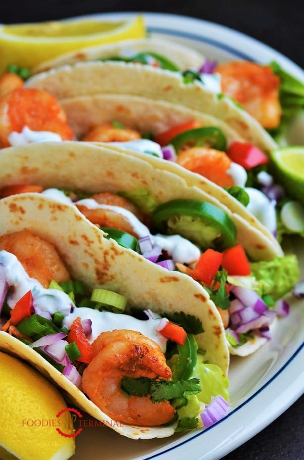 Cajun Shrimp Tacos served on a white plate