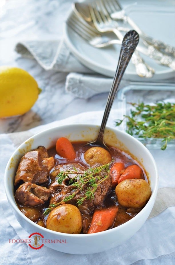 Lamb stew with vegetables in a white bowl