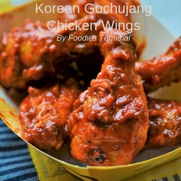 Korean Gochujang chicken wings served in a paper plate