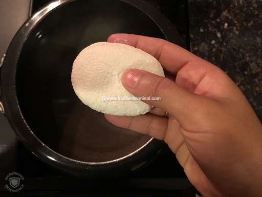 Dipping the cottage cheese or chena chops in the boiling sugar syrup