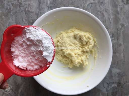 Adding powdered sugar to the cream or malai