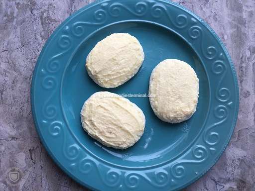Malai slathered cream chops on a blue plate
