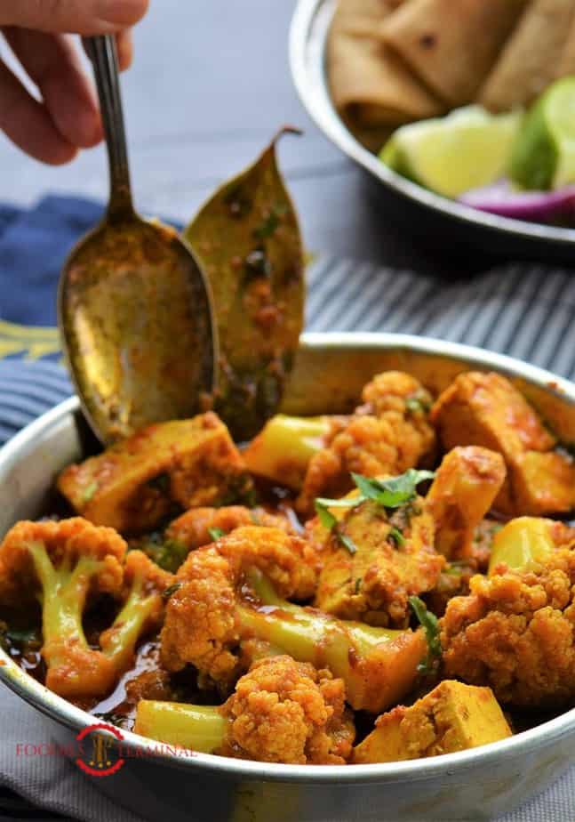 Cauliflower Paneer curry served in a metal plate