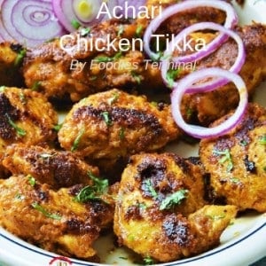 Achari Chicken Tikka Recipe served with onion rings