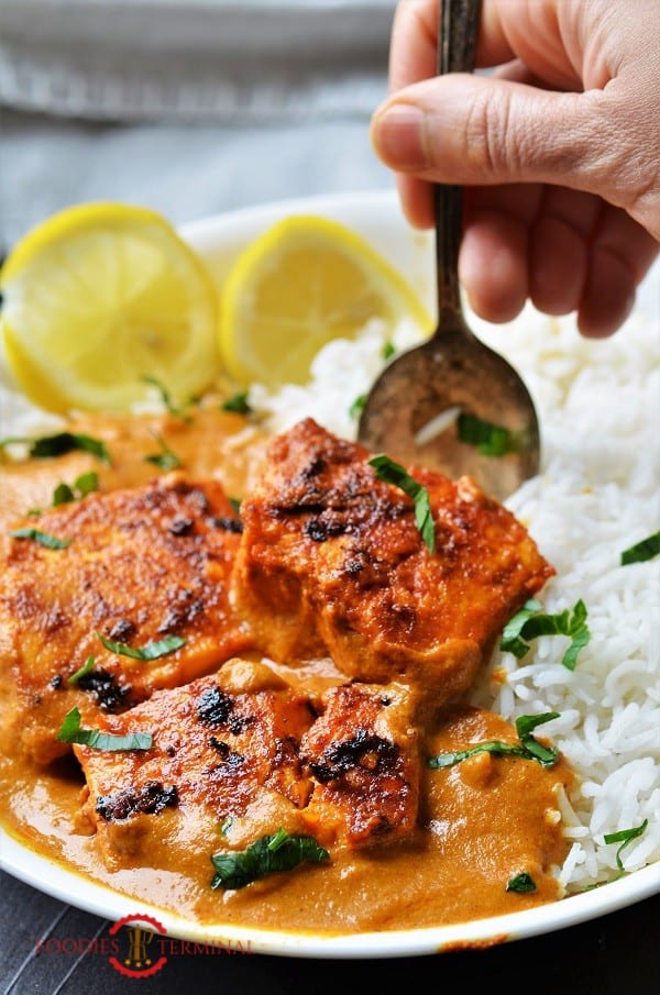 Fish tikka masala recipe served in a white plate