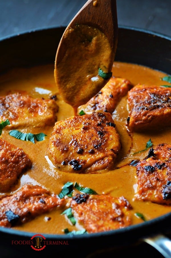 Fish Tikka masala cooked with salmon in a skillet