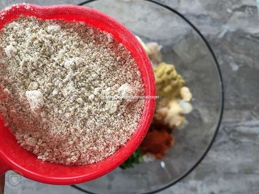 Oats flour in a red cup