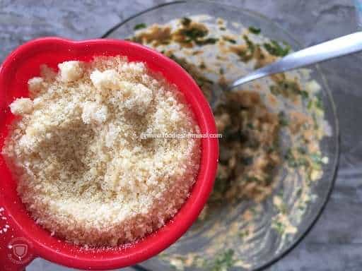 Parmesan cheese in a red bowl