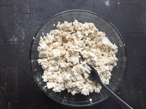 Scrambled tofu in a glass bowl