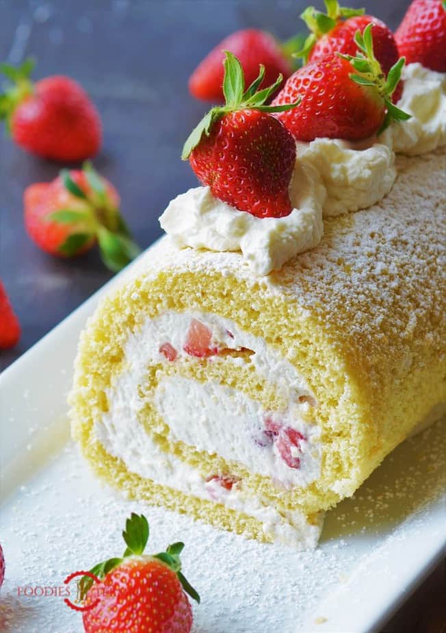 Swiss roll Cake with topped with strawberries