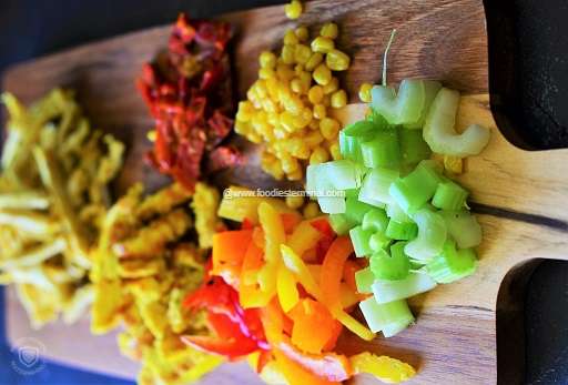 Chopped vegetables on a wooden chopping board