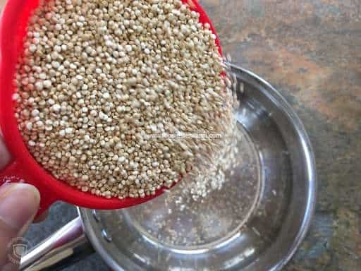 Pouring raw quinoa in a saucepan