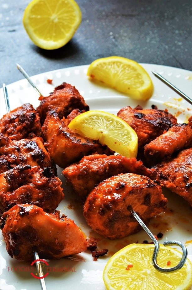 Chicken Boti Kabab served on metal skewers