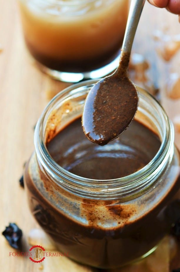 Kokum concentrate or Kokum syrup in a glass jar & a spoon