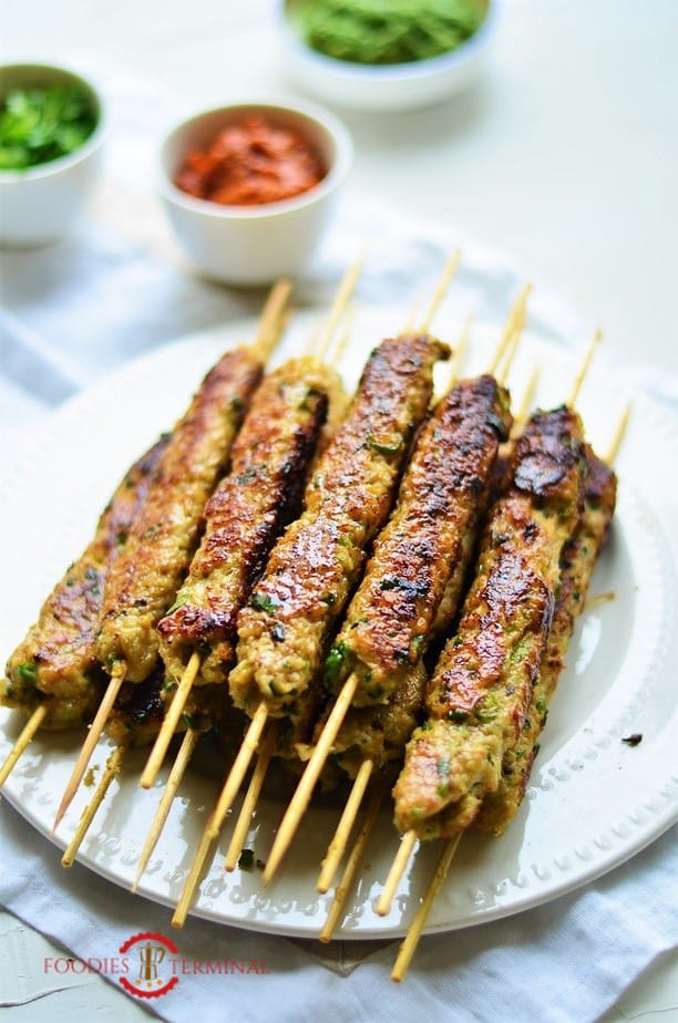 Chicken Seekh Kabab stacked on a white plate