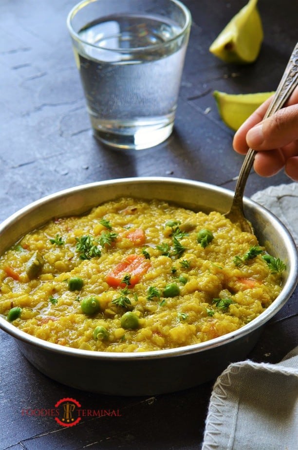 Instant Pot Quinoa Khichdi being lifted with a spoon
