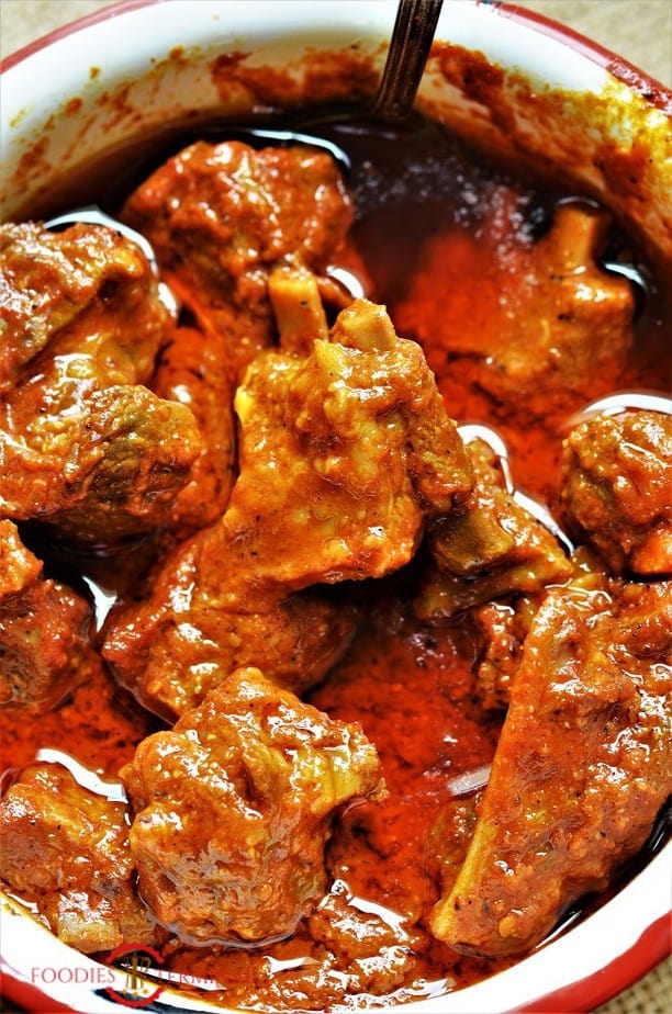 Junglee Maas in a spicy rich red gravy