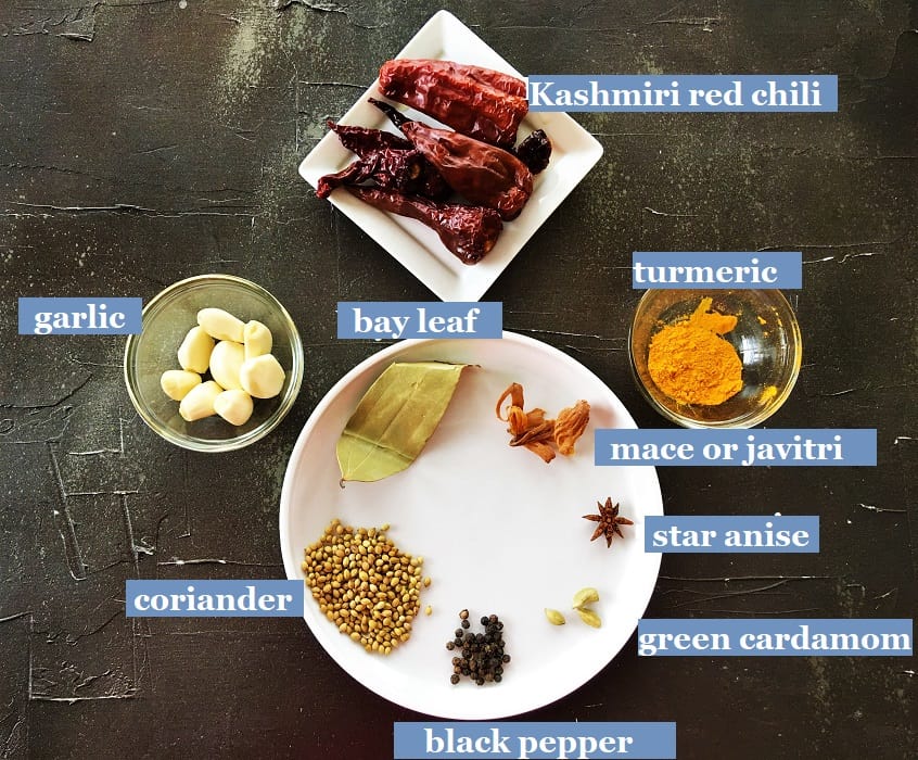 Special Masala paste ingredients on a black board for making the Junglee Maas recipe