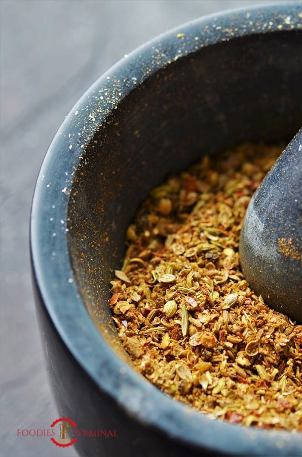 Kadai Masala ground coarsely in mortar & pestle