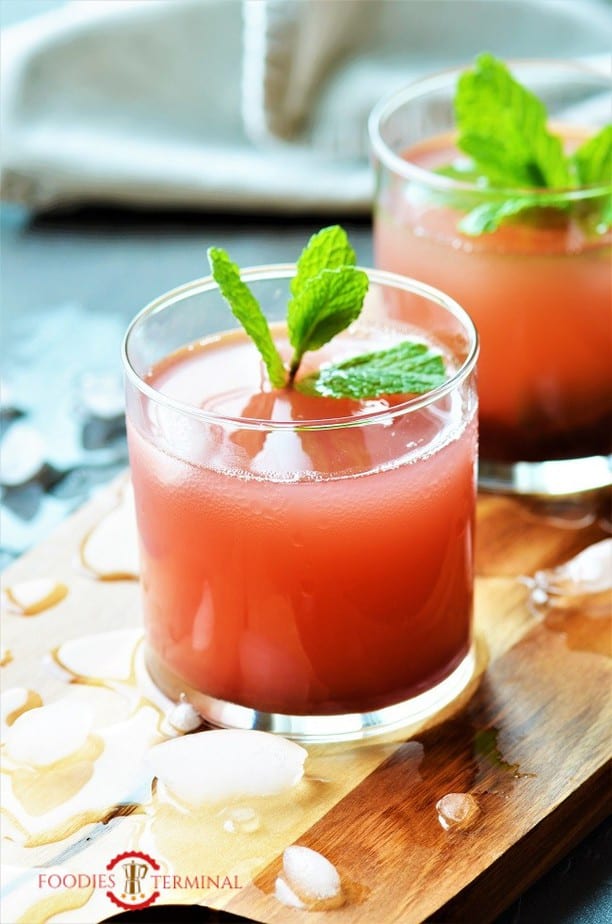 Kokum Sharbat served in transparent glass with ice cubes