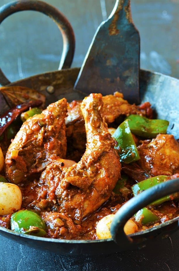 chicken karahi dhaba style served in an iron wok