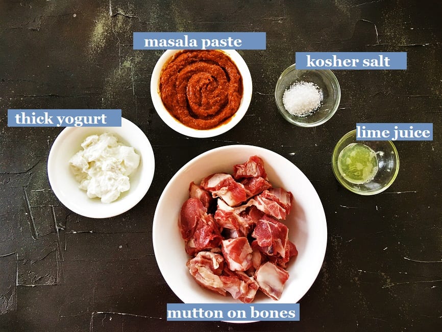 Recipe ingredients on a black board kept in white bowls & transparent bowls