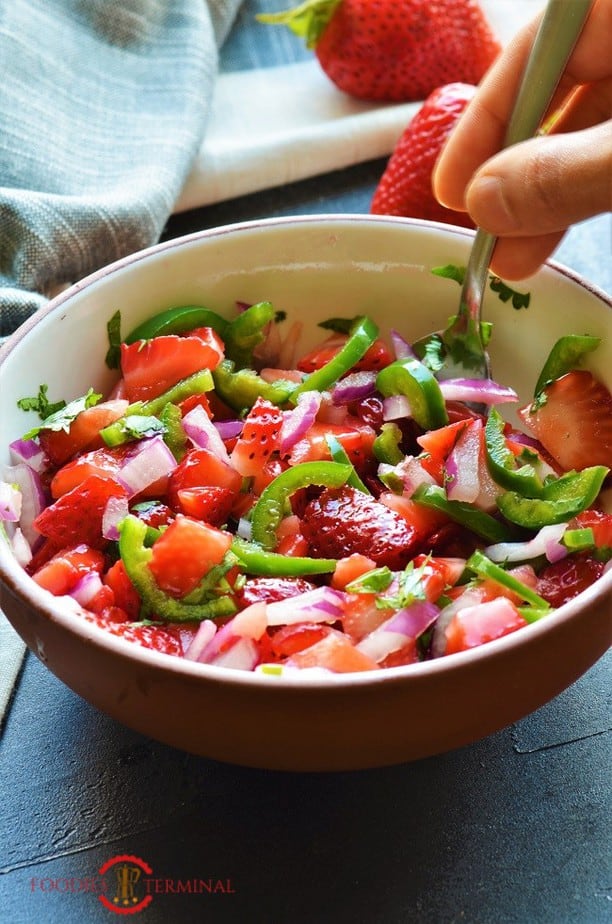 Strawberry Salsa served in a white bowl with a spoon