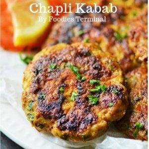 Chicken Chapli Kabab garnished with cilantro