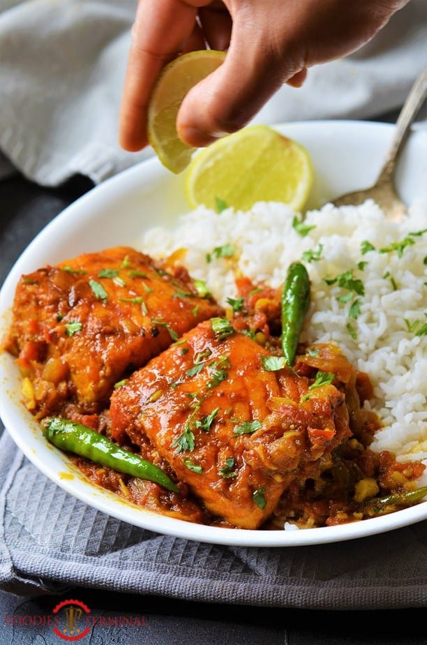 Salmon Curry Indian style served with white rice & green chilies