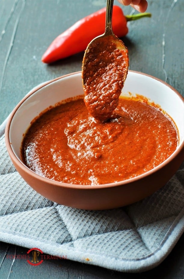 South African Peri Peri Sauce with a spoon dripping sauce