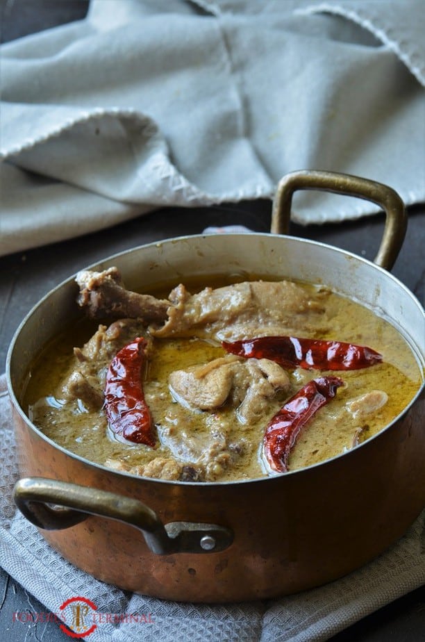 Bengali Chicken Rezala with doi posto  in a copper pot 