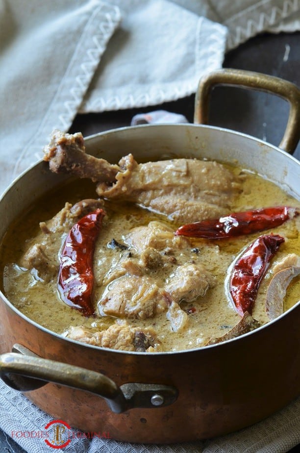 Aminias style Chicken rezala Kolkata style in a pot with brass handles